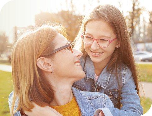 Smiling Mum and Daughter wearing glasses